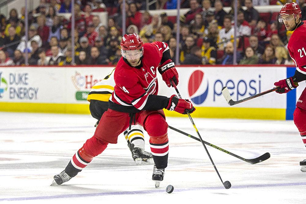 Forward Justin Williams dribbles the puck into Pittsburgh Penguins territory, Tuesday, March 19 in PNC Arena. Williams scored one goal after three shots on goal. The Canes won at home, 3-2.