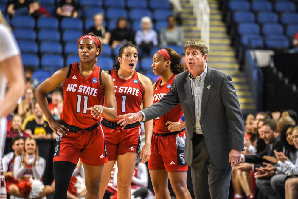 Head coach Wes Moore talks to graduate guard Kiara Leslie, junior guard Aislinn Konig and freshman guard Kai Crutchfield during their game against Iowa on Saturday, March 30, 2019 in the Greensboro Coliseum. The Pack lost to the Hawkeyes 79-61.