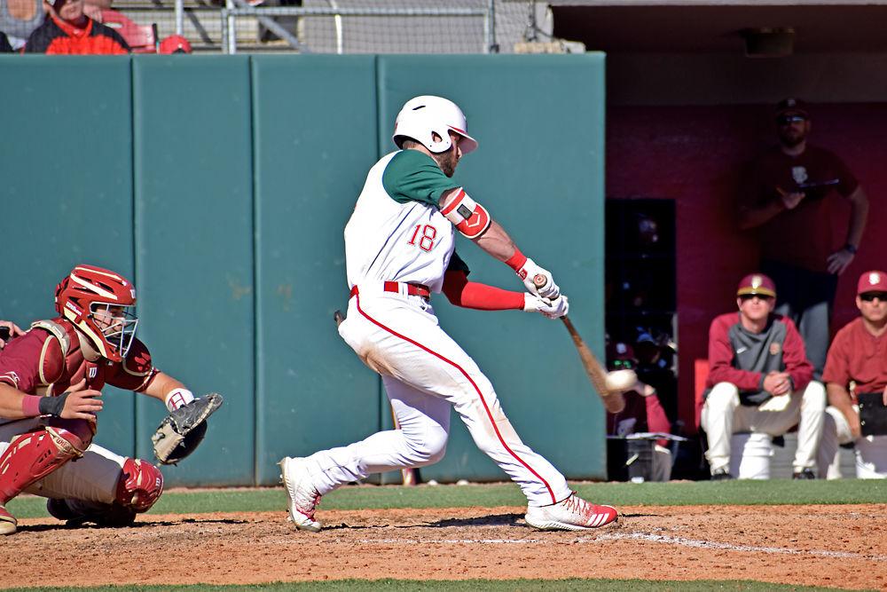 Senior infielder Evan Edwards makes contact with a pitch against Florida State on Sunday, March 17, in Doak Field. The Wolfpack lost 7-5 to the Seminoles, with Edwards registering two hits, one walk and one strikeout.