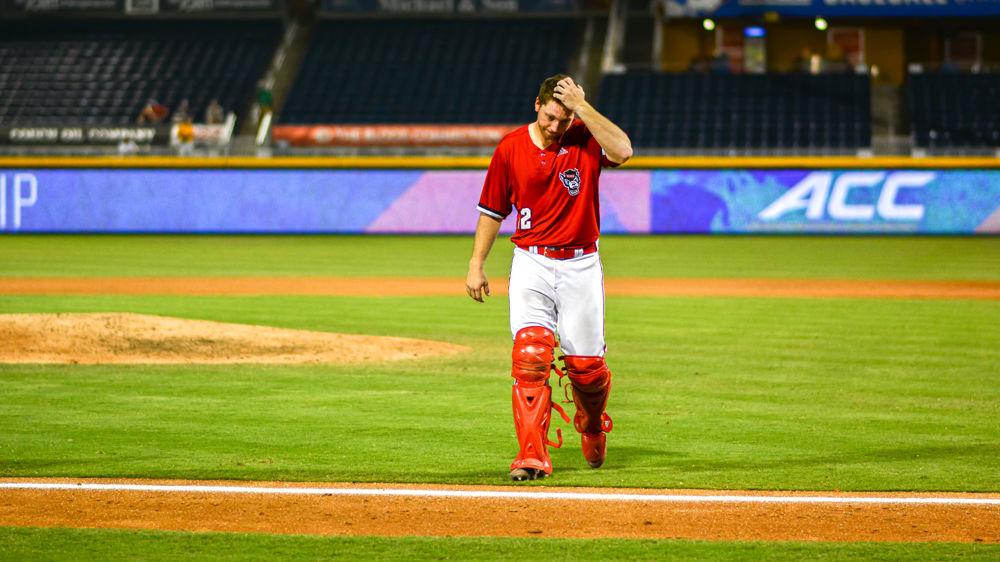 Junior catcher Brad Debo walks off the field after the Wolfpack&#8217;s 11-0 loss to Florida State on Friday, May 25 at Durham Bulls Athletic Park. Debo went 0-3 with two strikeouts.&#160;The Pack plays in the semifinals tomorrow, Saturday, May 25 against Georgia Tech at 5 p.m.