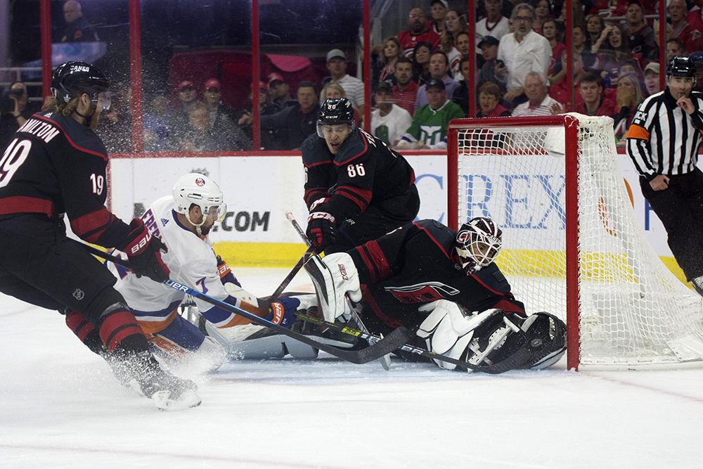 Carolina Hurricanes goalie Curtis McElhinney saves the puck from going into the net, Wednesday, May 1. McElhinney stopped 28 of 30 shots on goal. The Canes beat the New York Islanders with home ice advantage, 5-2, and lead the series with a 3-0 advantage.