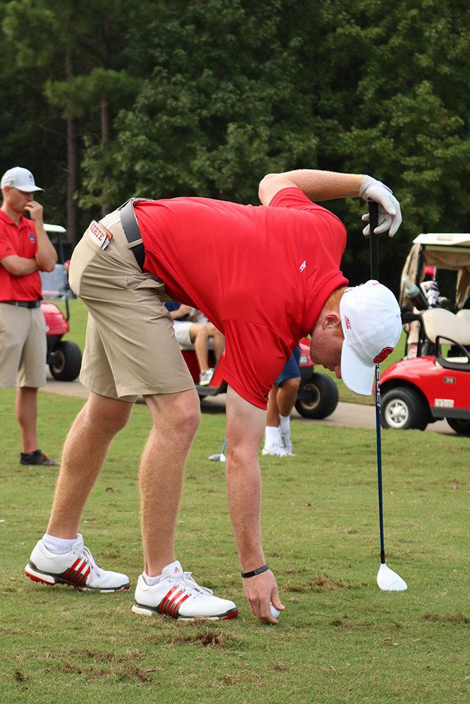 Senior Stephen Franken prepares to tee off at Lonnie Poole Golf Course on Oct. 6, 2018. Franken finished round two with a score of -3.