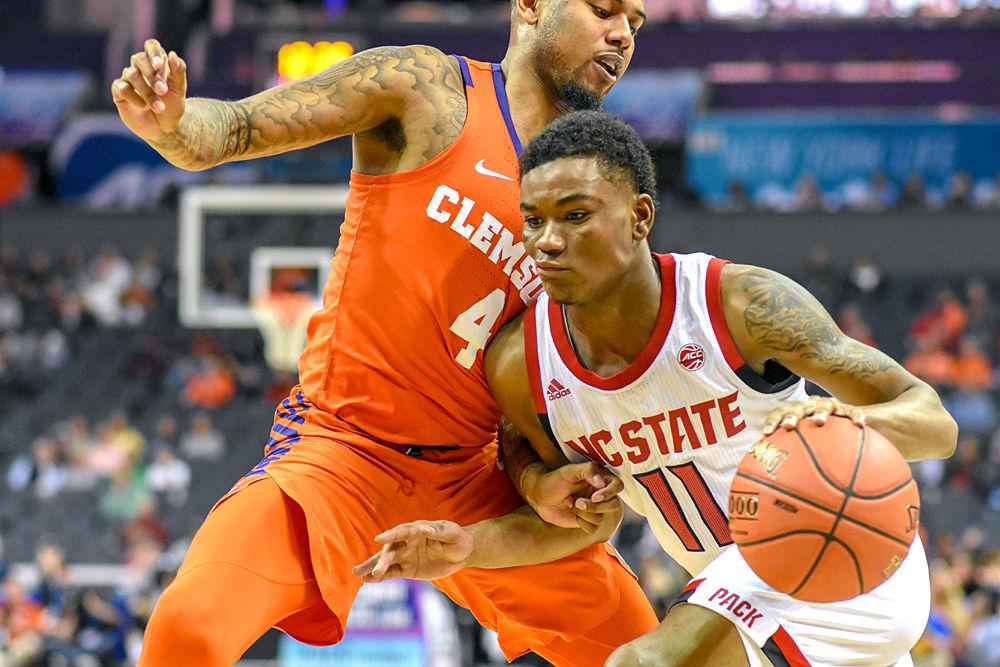 Junior guard Markell Johnson drives to the basket during the ACC Tournament against Clemson on Wednesday, March 13, 2019 in the Spectrum Center in Charlotte. Johnson scored a team-high 23 points. Johnson's performance against the Tigers helped the team overcome a 16-point deficit at the end of the first half, and the Wolfpack came out on top 59-58.