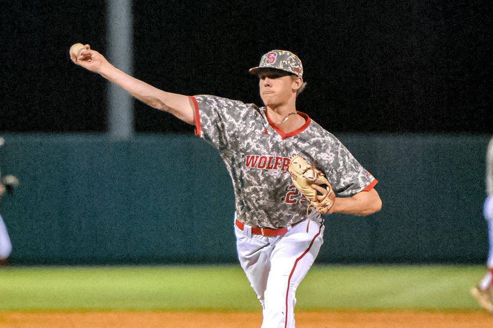 Sophomore pitcher Reid Johnston delivers a pitch to Virginia on Saturday, March 30, 2019 at Doak Field at Dail Park. The Wolfpack won 3-0.