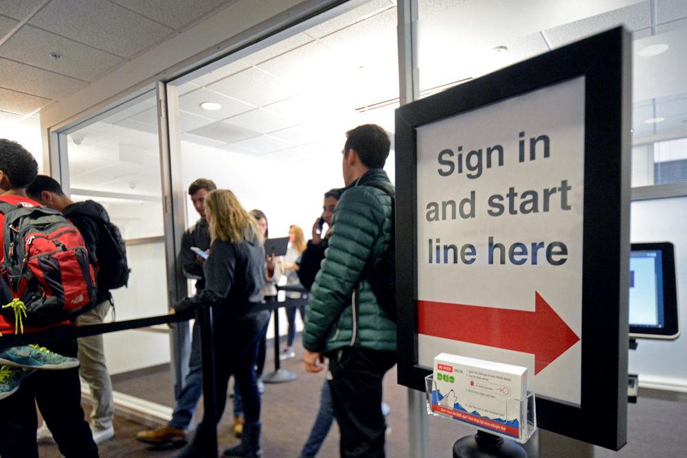 Students wait to be called to take their online exams at the Centennial Campus Testing Center in Venture IV on Thursday, Dec. 13, 2018. Due to changes in the exam schedules since the recent snow days, DELTA Testing Services has asked students to make online exam appointments before coming to the center in order to cut down on the amount of people waiting at Venture IV. Despite the shorter lines, students such as Riley Wenker, a third-year studying animal science, still had to wait up to three-and-a-half hours to take his exam.