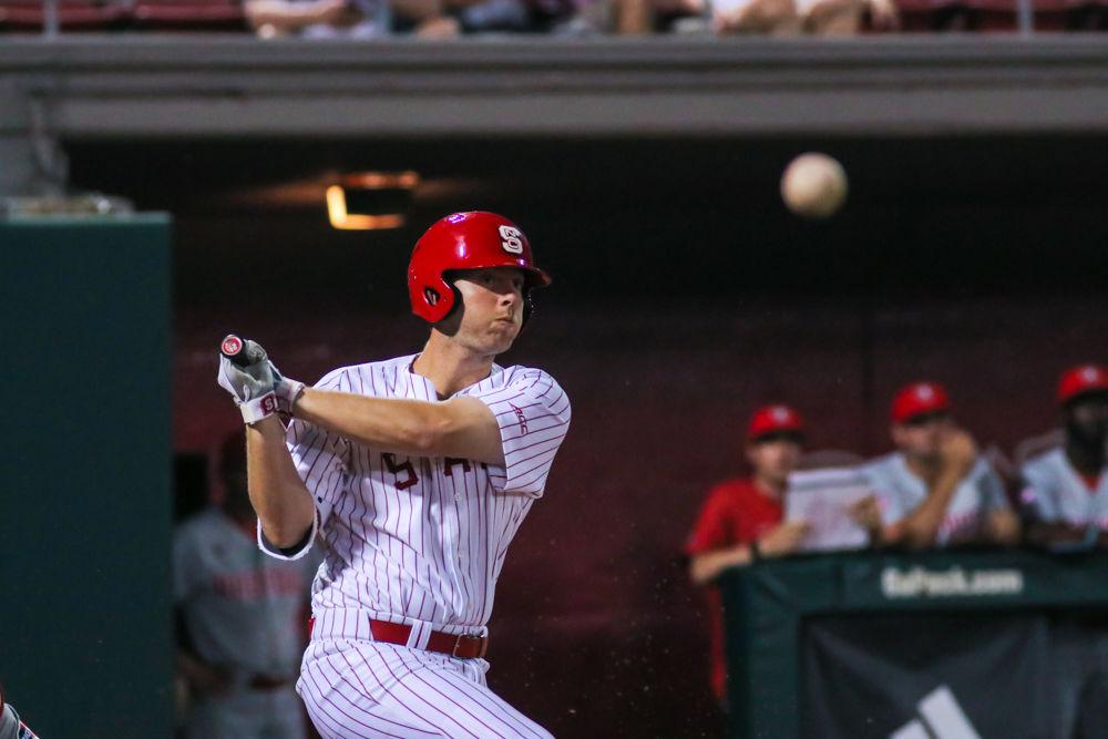 Junior catcher Brad Debo hits the ball versus Radford on Friday, May 3, 2019 at Doak Field. Debo had two hits during the game where the Wolfpack won 6-3.