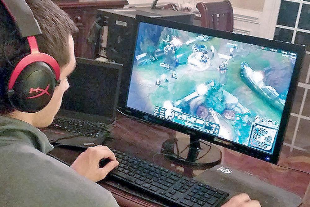 Senior Stephen Downhower, jungler of the League of Legends team at NC State, plays League of Legends on his computer at home. He plays under the username &#8220;Pluckin Penguin.&#8221;