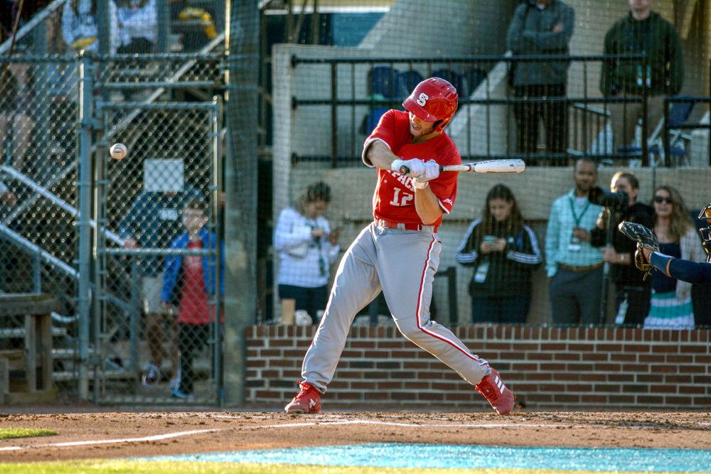 Junior catcher Brad Debo swings at a pitch against the UNC-Wilmington Seahawks on Tuesday, April 16, 2019 at Brooks Field in Wilmington. Debo had one home run and three runs batted in for the Wolfpack. The Pack beat the Seahawks 14-7.