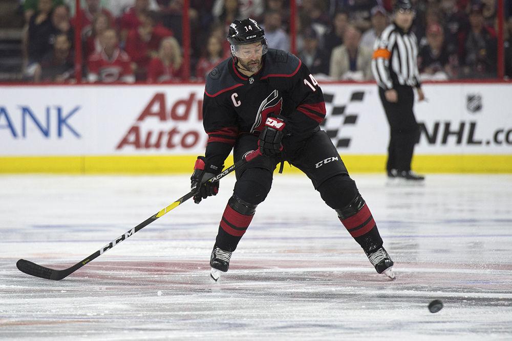 Right winger and captain Justin Williams takes possession of the puck during the third period against the New York Islanders, Wednesday, May 1 in PNC Arena. The Canes beat the New York Islanders with home ice advantage, 5-2, and lead the series with a 3-0 advantage.