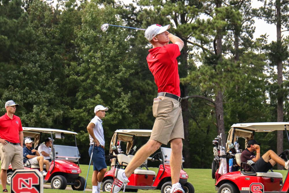 Senior Stephen Franken takes a swing to drive the ball down range. Franken finished strong with a score of -3 in the 2nd round at Lonnie Poole Golf Course on Oct. 6th 2018.
