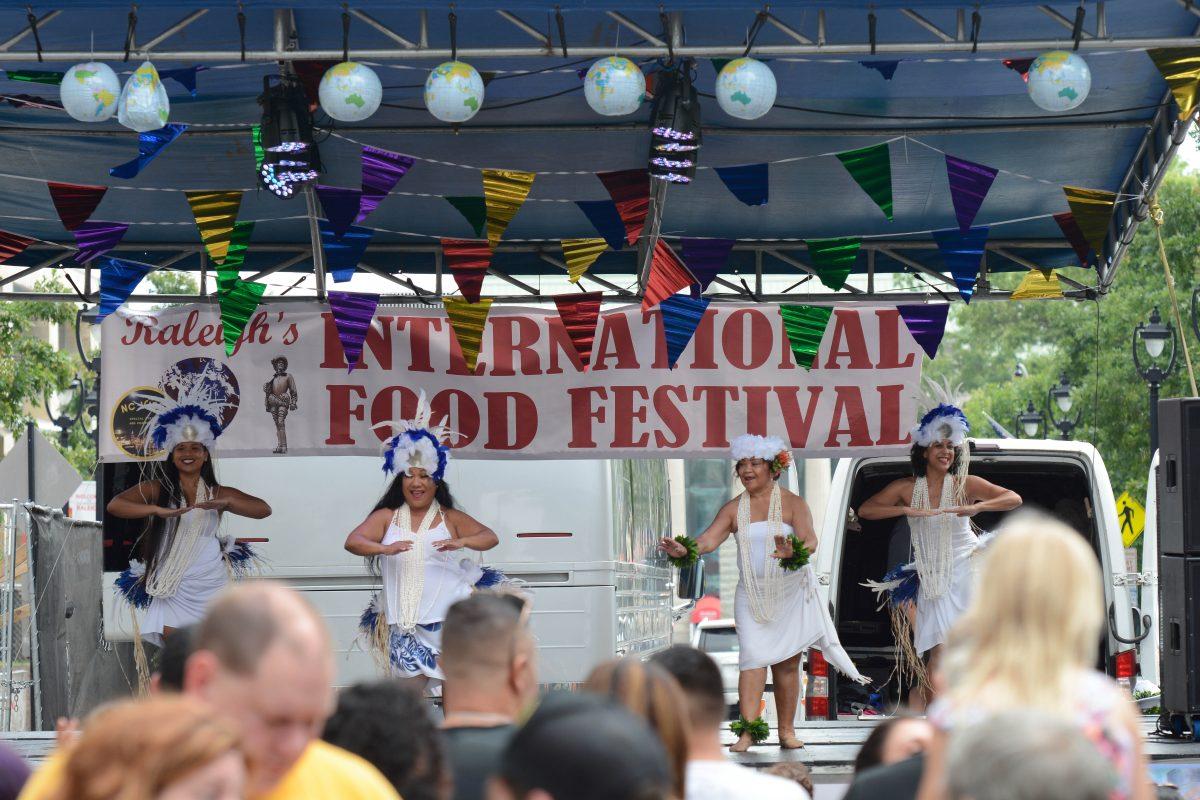 Performers dance at the international food festival on Saturday, Jun. 8, 2019 at City Plaza in downtown Raleigh.