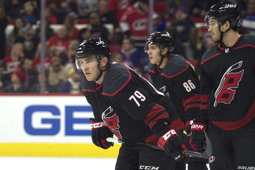 Winger Michael Ferland, right wing Teuvo Teravainen, and defenseman Brett Pesce cluster up to wait for the puck drop durign the game against the Buffalo Sabres in PNC Arena, Friday, Jan. 11. Ferland, assisted by Teravainen and Jaccob Slavin, scored in the first period to get the Hurricanes an early lead, and helped solidify the victory with two assists in the second period. The Carolina Hurricanes won at home, 4-3.&#160;