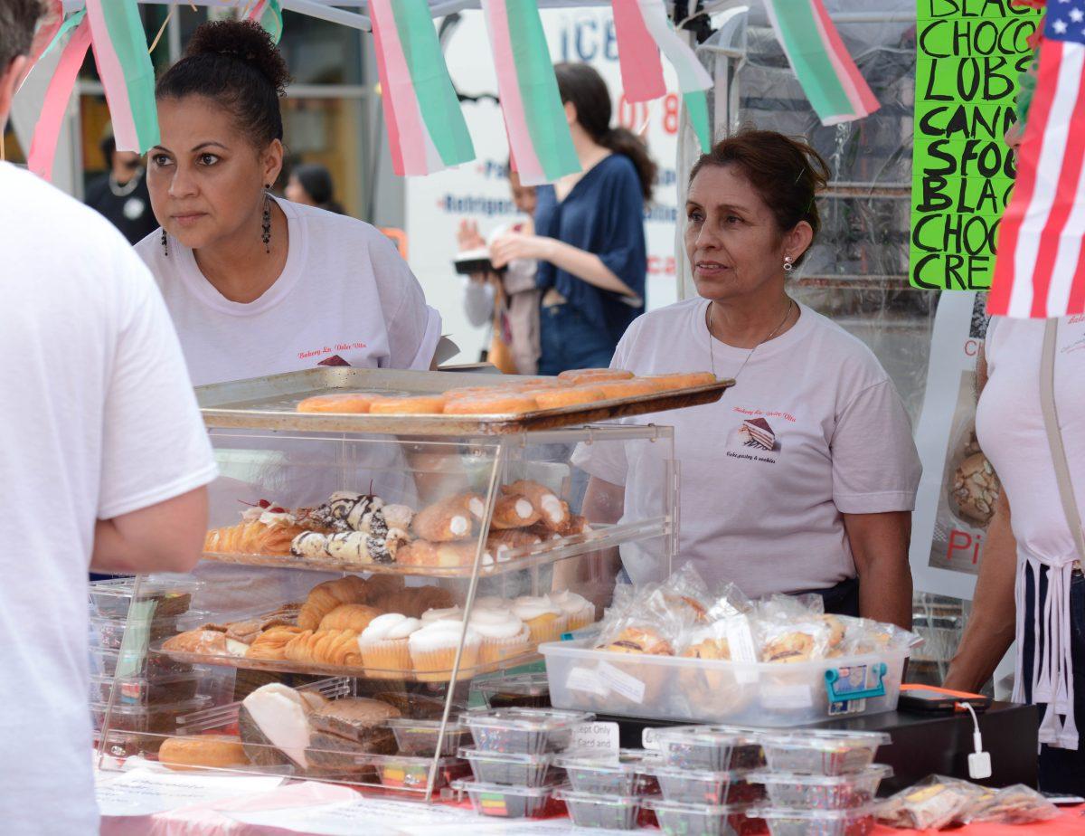 Ana Ames and Gloria Valdes take orders at the Bakery La Dolce Vita stand at the international food festival on Saturday, Jun. 8, 2019 at City Plaza in downtown Raleigh.