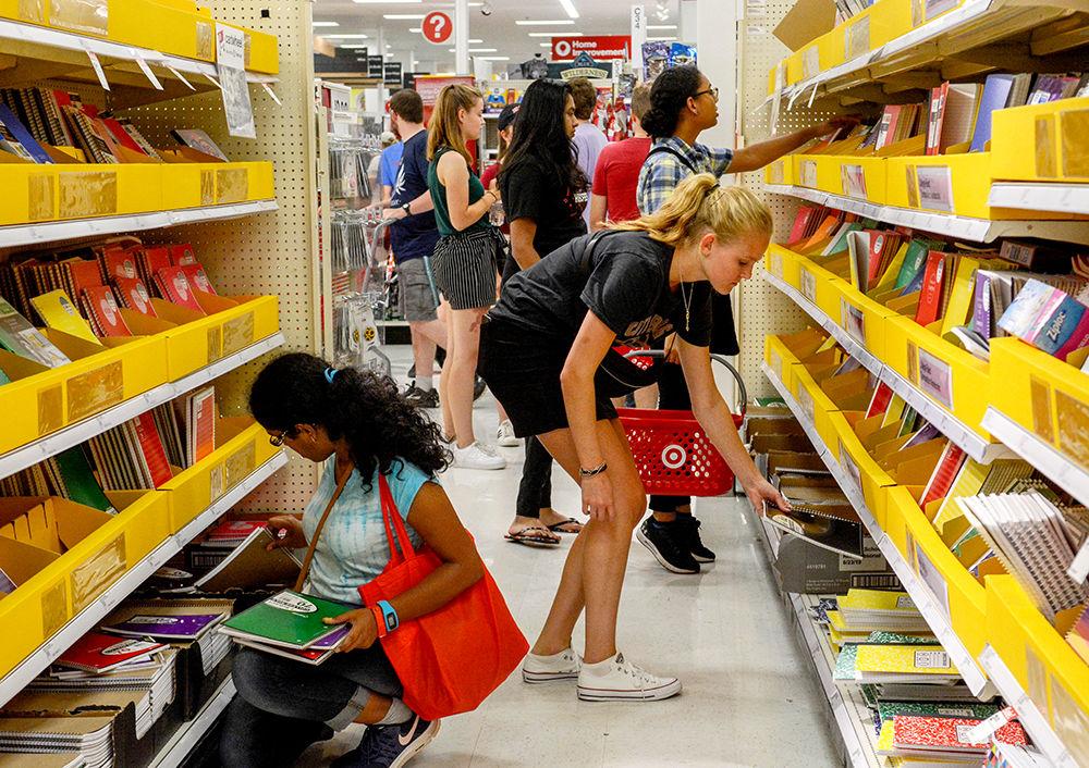 Students grab school supplies for the upcoming academic year at the 2019 Target Run on Sunday, August 18, 2019 in the Target at Cary Crossroads. The Target Run is an annual Wolfpack Welcome Week event that has music, give-aways, and free goodie bags while also allowing students to make purchases for the upcoming school year.