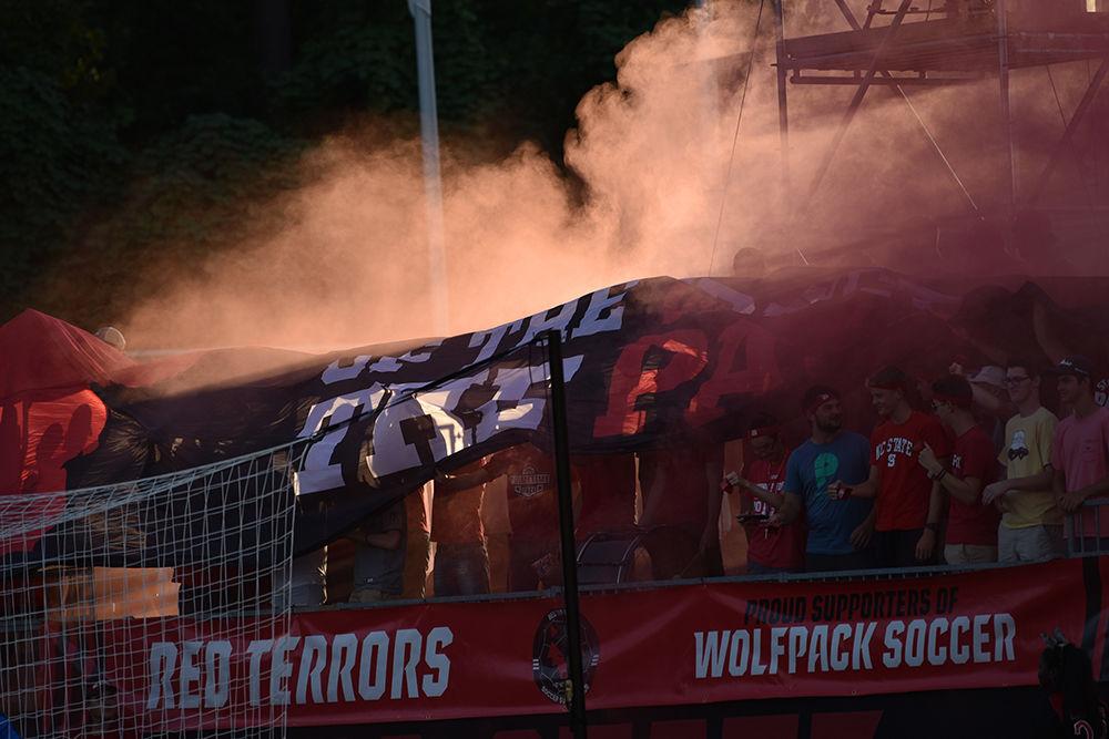 The NC State student section cheers at the beginning of the first half of the game versus Loyola on Friday, August 30, 2019 in Dail Soccer Park. NC State beat Loyola 2-1.