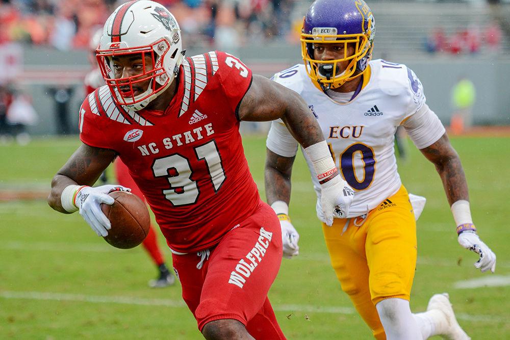 Redshirt junior safety Jarius Morehead runs the ball in the last home football game versus ECU on Saturday, Dec. 1, 2018 in Carter-Finley Stadium. The Wolfpack beat the Pirates 58-3.