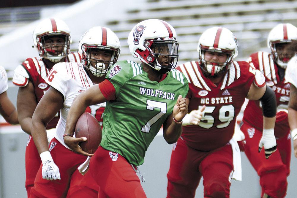 Redshirt sophomore quarterback Matthew McKay runs through the defense during the Kay Yow Spring Game on Saturday, April 6, 2019 in Carter-Finley Stadium.