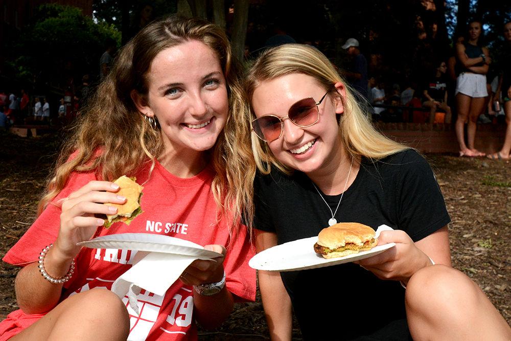 First year communication students Jaidan Rubinstein and Abby Davis enjoy their food at the Chillin' &amp; Grillin' event on Tuesday, August 20, 2019 at Tucker Owen Beach. This annual cookout is hosted by the Interfraternity Council and the Inter-Residence Council to welcome new students.