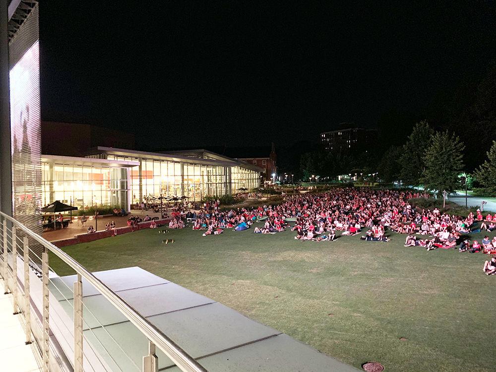 NC State students sit on the green outside of Talley Student Union on Friday, Aug. 16, 2019 for a showing of Aladdin. Screen on the Green is an annual event produced by Universities Activities Board.