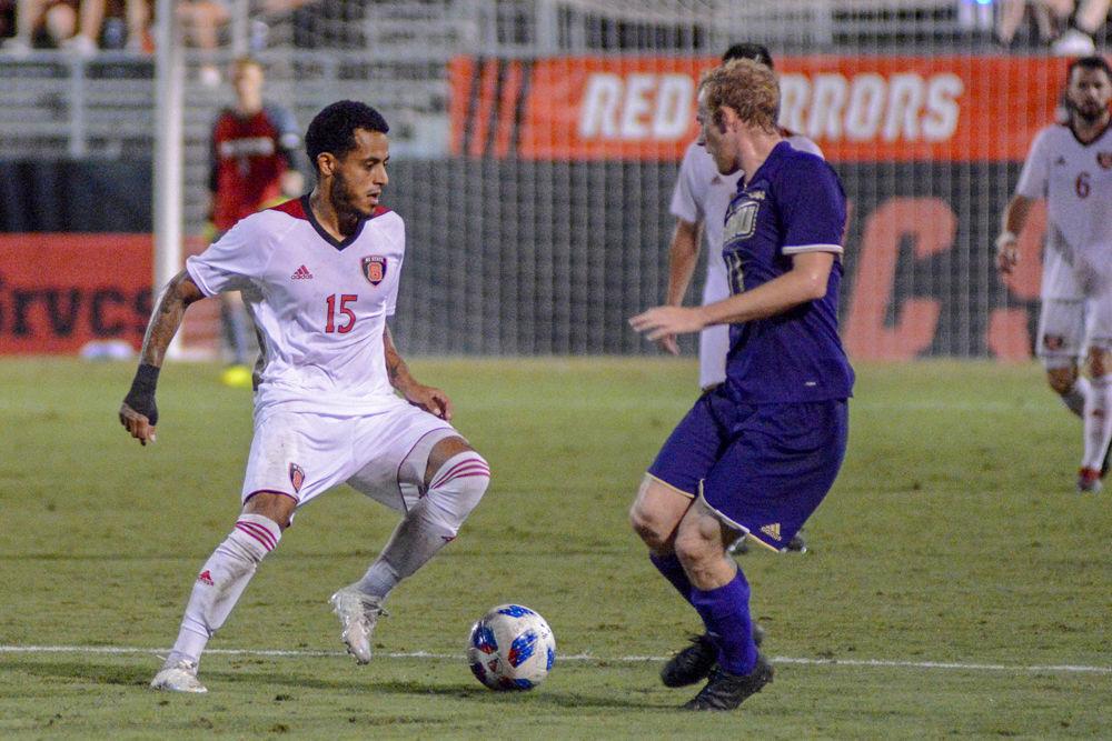 Junior midfielder Gabriel Machado makes a cut against the James Madison defense on Tuesday, Oct. 2 at Dail Soccer Field. The game ended in a 0-0 tie after two overtime periods.