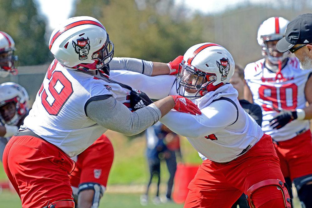 Redshirt junior defensive tackle Val Martin fights to get past sophomore defensive tackle Alim McNeill on Saturday, March 2, 2019 at NC State Football&#8217;s outdoor practice fields.
