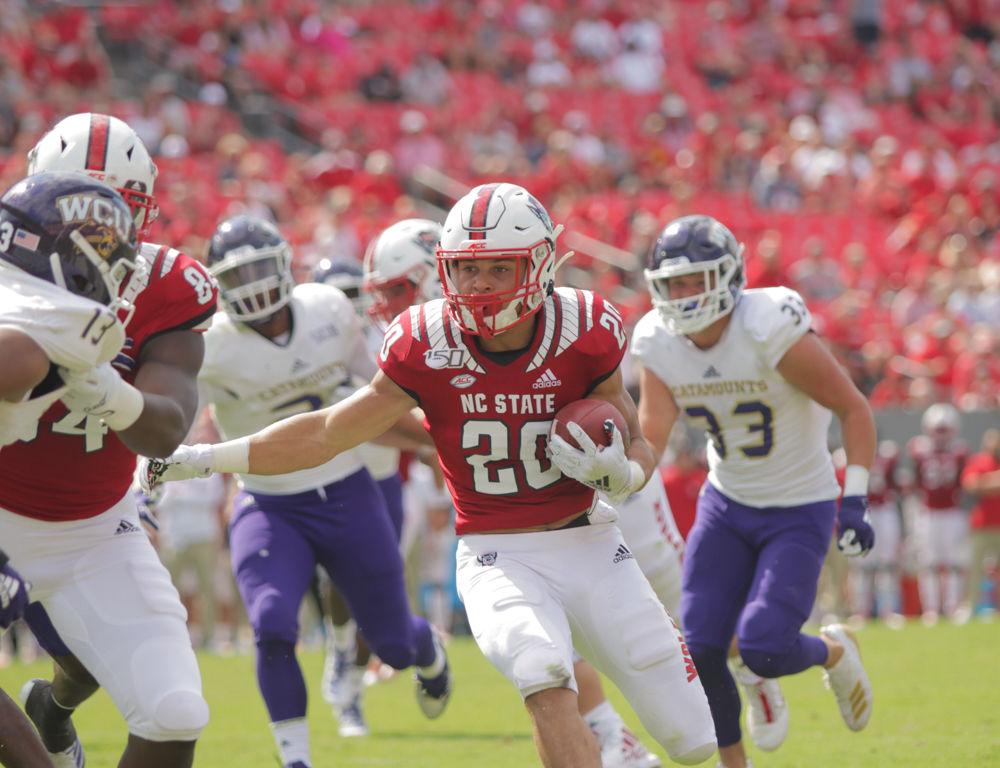 Freshman running back Jordan Houston rushes during the game versus WCU on Saturday, Sept. 7, 2019 at Carter-Finley Stadium. Houston rushed for 73 yards and had one touchdown. The Wolfpack beat WCU 41-0.