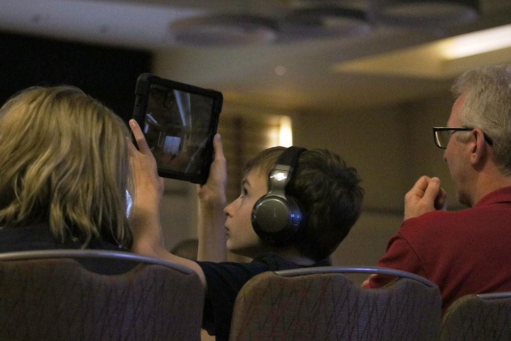 Gabriel Golch, age 11 of Mooresville, takes a video of Christina Koch's livestream from the International Space Station in Talley Student Union on Friday, Aug. 30, 2019. Christina Koch is an NC State alumni with degrees in electrical engineering and physics who is on track to be the first woman to have stayed more than 330 days in space. She was also a part of the team that performed the first all-female spacewalk.