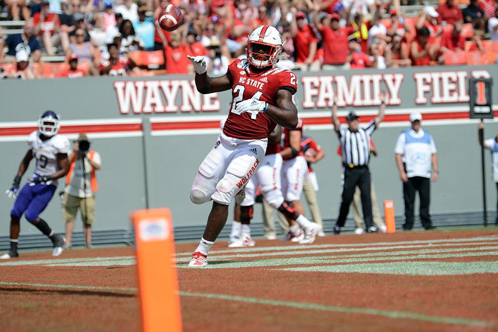 Freshman running back Zonovan Knight celebrates after scoring a touchdown at Carter-Finley Stadium on Saturday, Sept. 7, 2019. Knight rushed 119 yards and scored two touchdowns leading The Wolfpack in victory against WCU, 41-0.