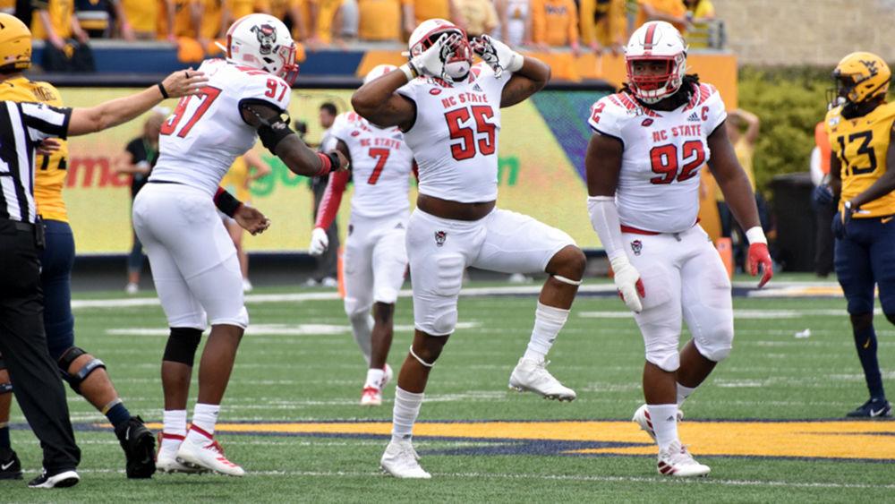 Redshirt graduate defensive end Deonte Holden celebrates a sack against West Virginia on Saturday, Sept. 14, 2019 at Milan Puskar Stadium. The Wolfpack lost 44-27.