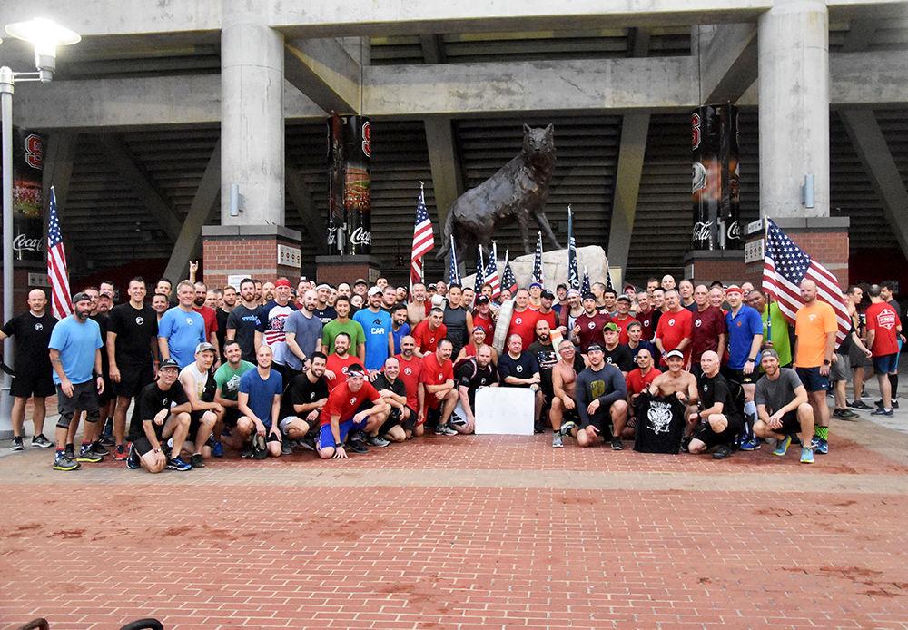 F3 members and other Raleigh residents gather for a group picture after the annual 9/11 Stair Climb on Sept. 11, 2019. The group climbed the staircases of Carter-Finley stadium in remembrance of the lives lost in the Twin Towers in 2001.