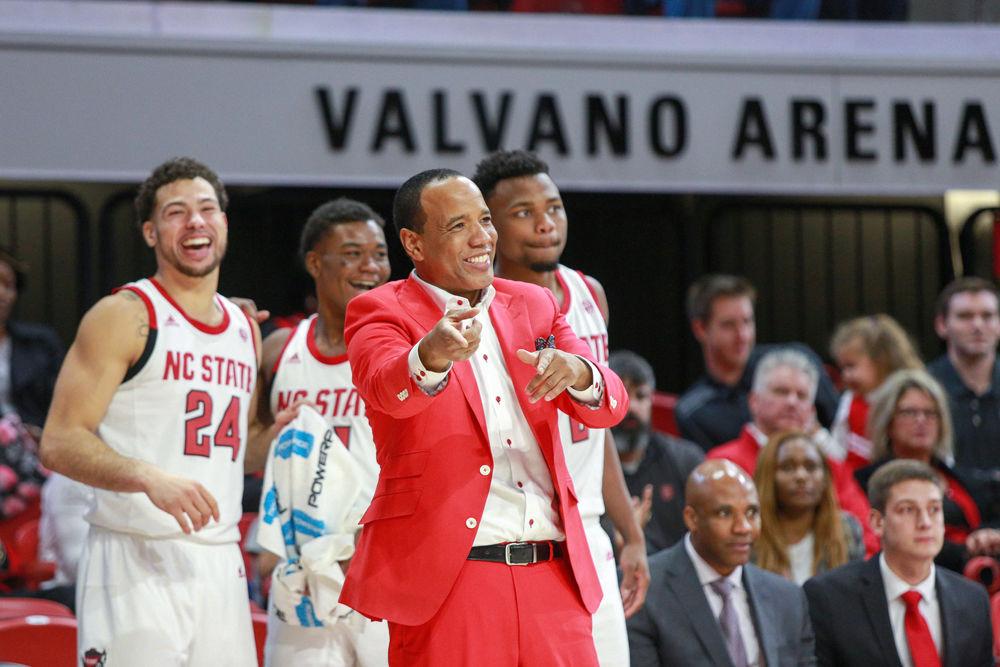 Head coach Kevin Keatts acknowledges a play as Devon Daniels, Markell Johnson, and Torin Dorn celebrate a three point basket. The team shot nearly 50 percent from three during the 100-67 win over Western Carolina on Wednesday, Dec. 5 in Reynolds Coliseum.