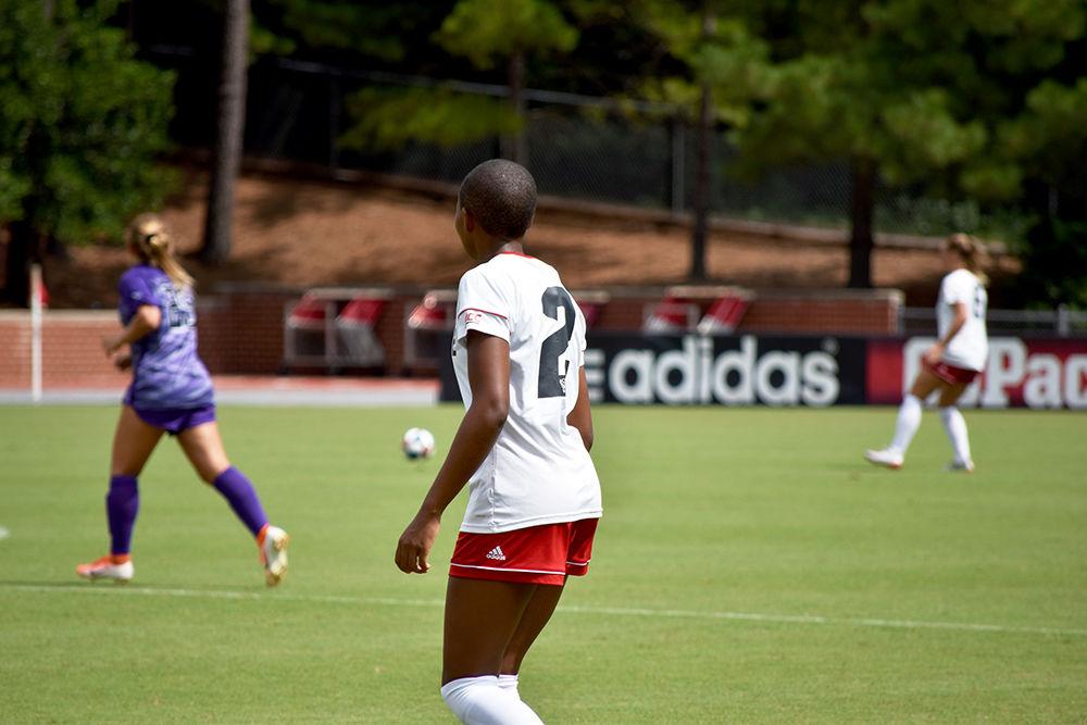Senior midfielder Tziarra King keeps a close eye on the ball as it moves up field. King acquired the second hat-trick of her career and lead NC State in their 3-1 victory over Furman University on Sunday, September 15, 2019.