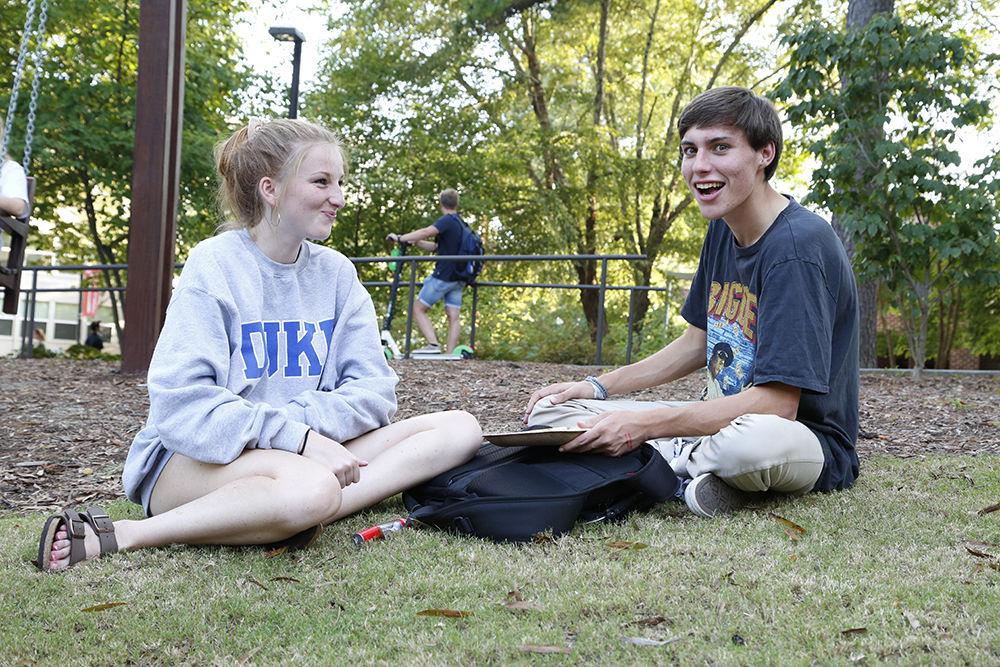 Dinah and Frank enjoy a plate of grapes on the grass at the All Carolinas Meal on Tuesday, Sep. 10, 2019. The annual meal features a wide variety of fresh local produce and recipies.