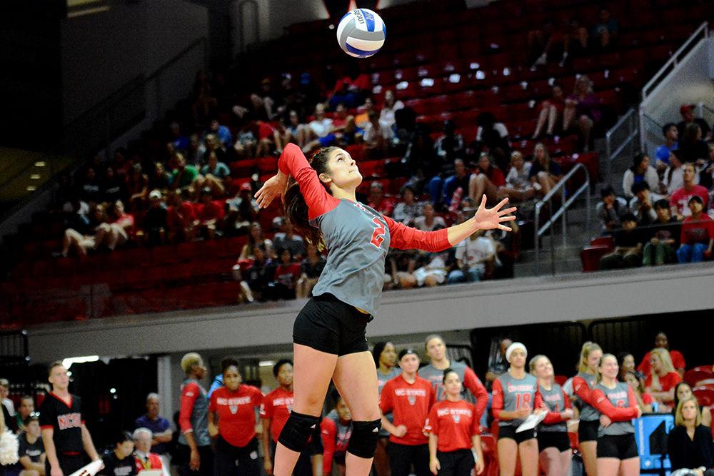 Third-year defense specialist Grace Irvin prepares to serve on Friday Sept. 21, 2018 in Reynolds Coliseum. Irvin had 11 digs as the Wolfpack lost to Louisville 3-1.