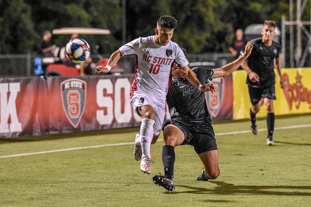 Junior midfielder David Loera fights to maintain possession of the ball during the game versus Loyola on Friday, August 30, 2019 in Dail Soccer Park. Loera had one assist against the Greyhounds. NC State beat Loyola 2-1.