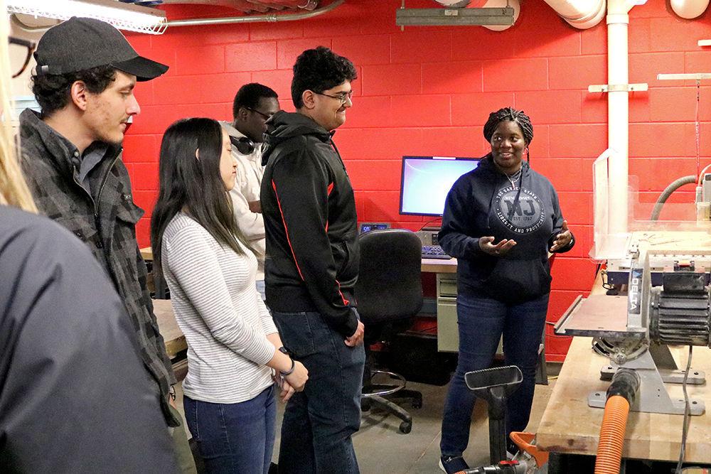 Dasola Olanrewaju, a fourth-year studying computer engineering and electrical engineering, explains workshop spaces at the eGarage new-member orientation on Monday, Feb. 11, 2019 at Innovation Hall on Centennial Campus. The eGarage has multiple rooms for students to create prototyping projects and share entrepreneurial ideas.