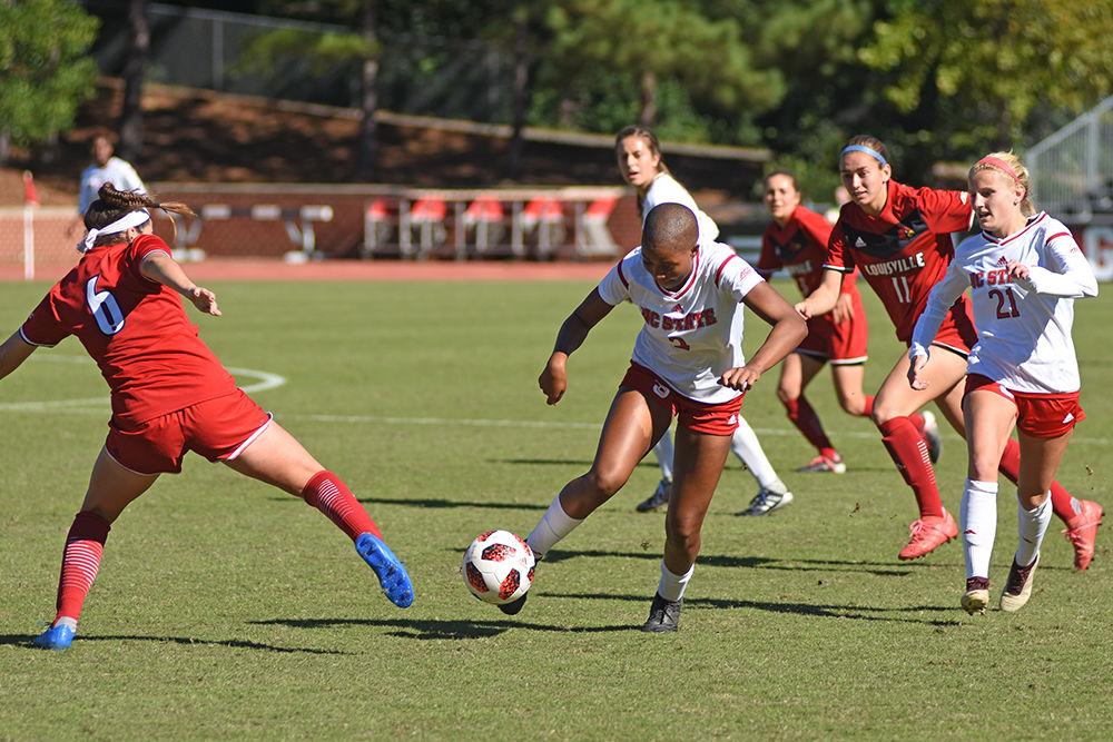 Junior midfielder Tziarra King kicks the ball during the women's soccer game against Louisville on Sunday, Oct. 21 in Dail Soccer Stadium. The Wolfpack fell to the Cardinals 2-1.