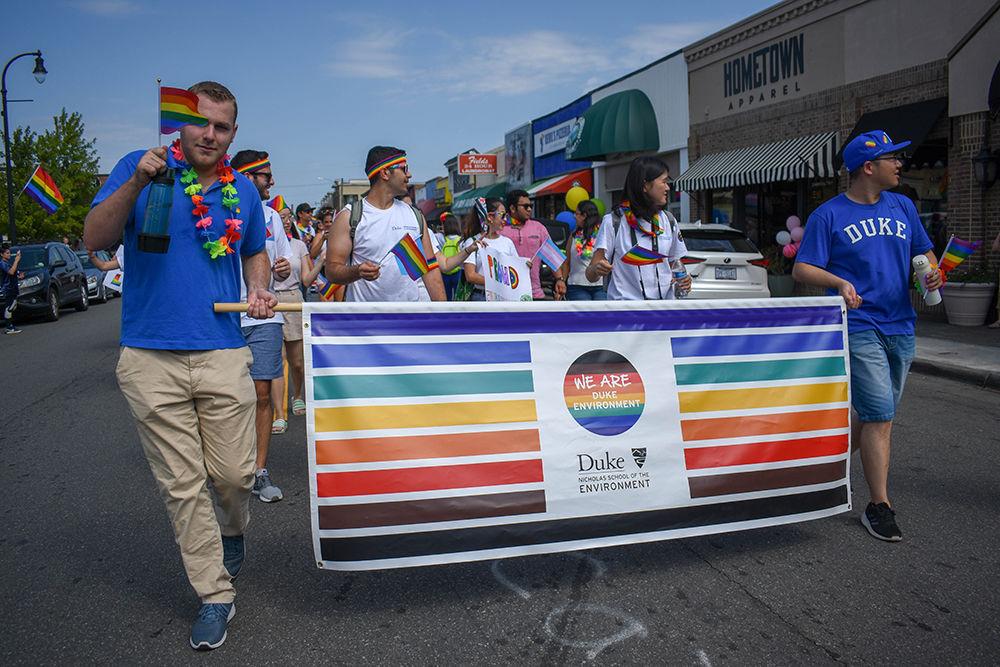 Members of the Duke Nicholas School of the Environment march during the annual Durham Pride parade on Saturday, Sept. 28, 2019 on Duke's east campus. The Pride events in Durham started in 1981 after protests by the LGBTQ community in response to a murder and attack of sunbathers at the Little River. The Pride event in Durham has continued to be a way for the city to celebrate and support their LGBTQ+ community.