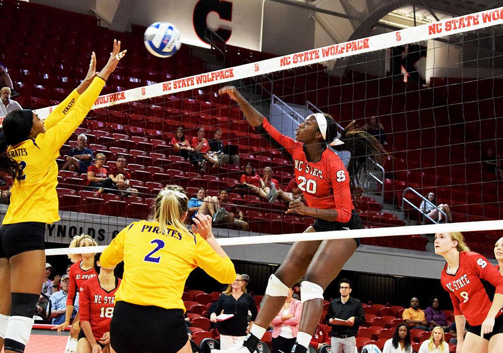 Senior middle blocker Lauryn Terry smashes the ball against East Carolina University during their match on Tuesday, Sept. 10, 2019 at Reynolds Coliseum. The Wolfpack lost to the pirates 2-3.