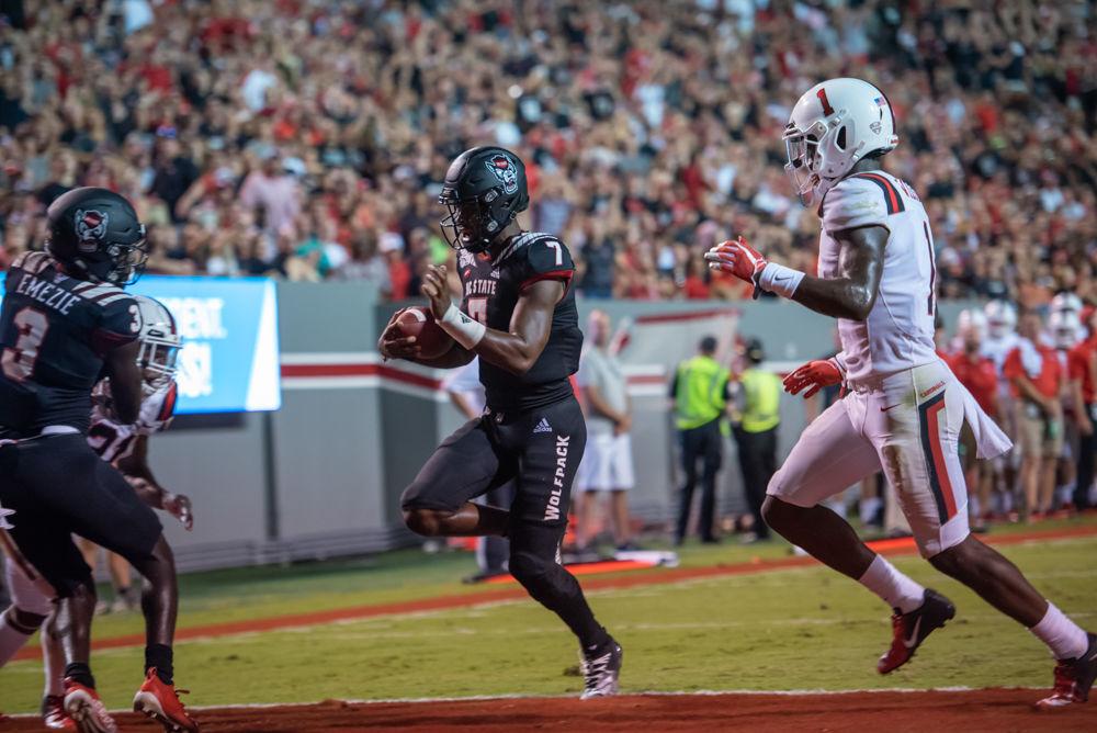 Redshirt sophomore quarterback Matthew McKay running into the endzone for a touchdown to put the NC State Wolfpack up 20-7 against the Ball State Cardinals on Saturday, Sep. 21, 2019 at Carter-Finley Stadium. McKay completed 17 out of 30 passes for 175 yards and one interception.The NC State Wolfpack would go on to beat the Ball State Cardinals 34-23.