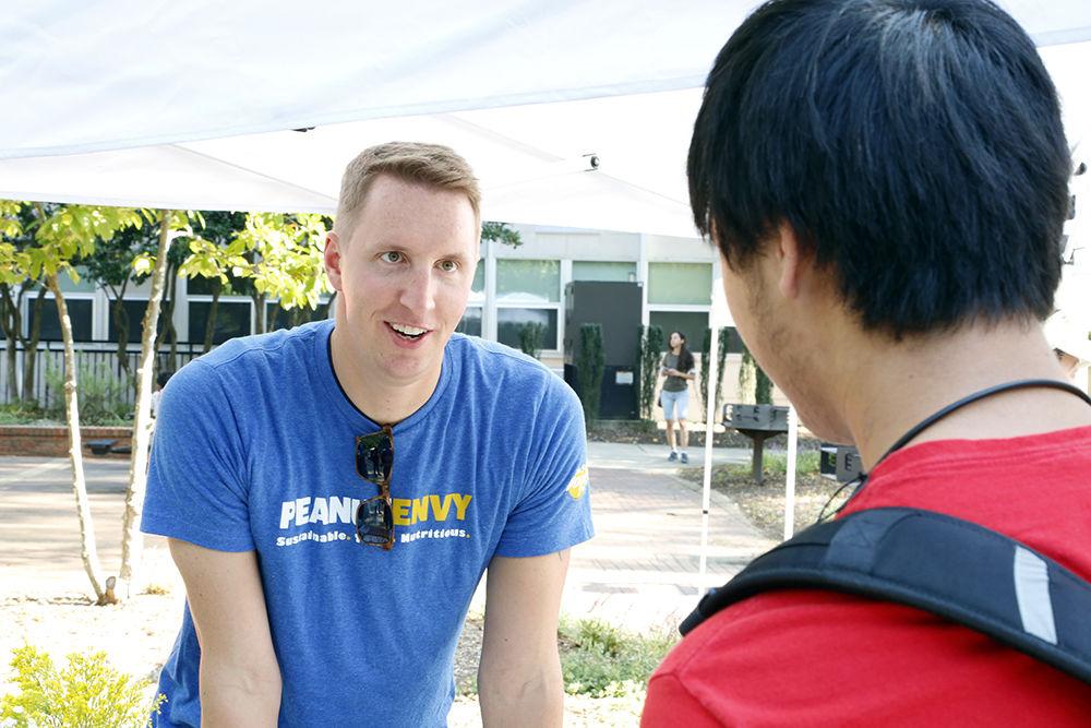 Keegan Treadway from the National Peanut Board ask a student peanut trivia for a free shirt at the All Carolinas Meal on Tuesday, Sep. 19, 2019. Students were able to share instagram post for prizes and merch.