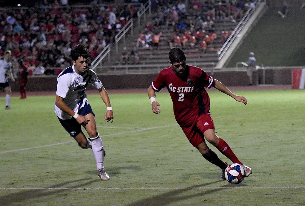Freshman defender Pablo Pedregosa dribbles the ball against Longwood on Friday, Sept. 6, 2019&#160;at Dail Soccer Field. NC State beat Longwood 1-0.