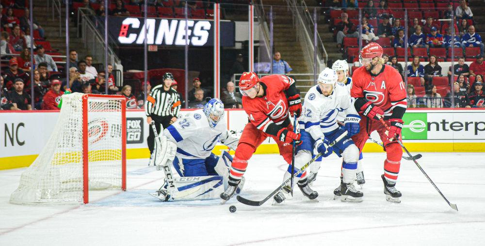 Carolina Hurricanes winger Julien Gauthier reaches for the puck but can't get control near the Tampa Bay Lightning net on Wednesday, Sept. 18, 2019 at PNC Arena. Gauthier totaled one assist and one shot on goal as the Hurricanes won 2-0.