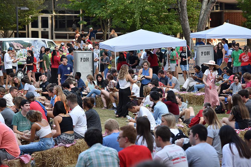 NCSU students gather outside Fountain Dining Hall to enjoy live music and souuthern food at All Carolinas Meal on Tuesday, Sept. 10, 2019.
