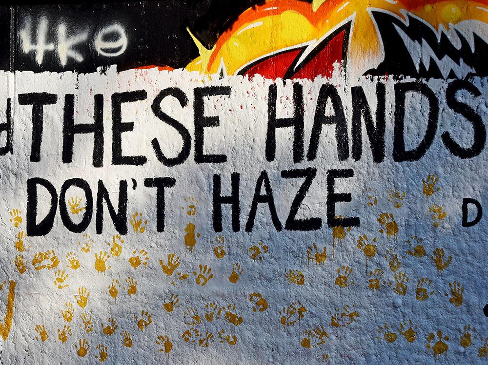 The Order of Omega sponsors a painting of the free expression tunnel. The group painted &#8220;These hand don&#8217;t haze&#8221; followed by many hand prints below the saying, on Tuesday, September 24, 2019.
