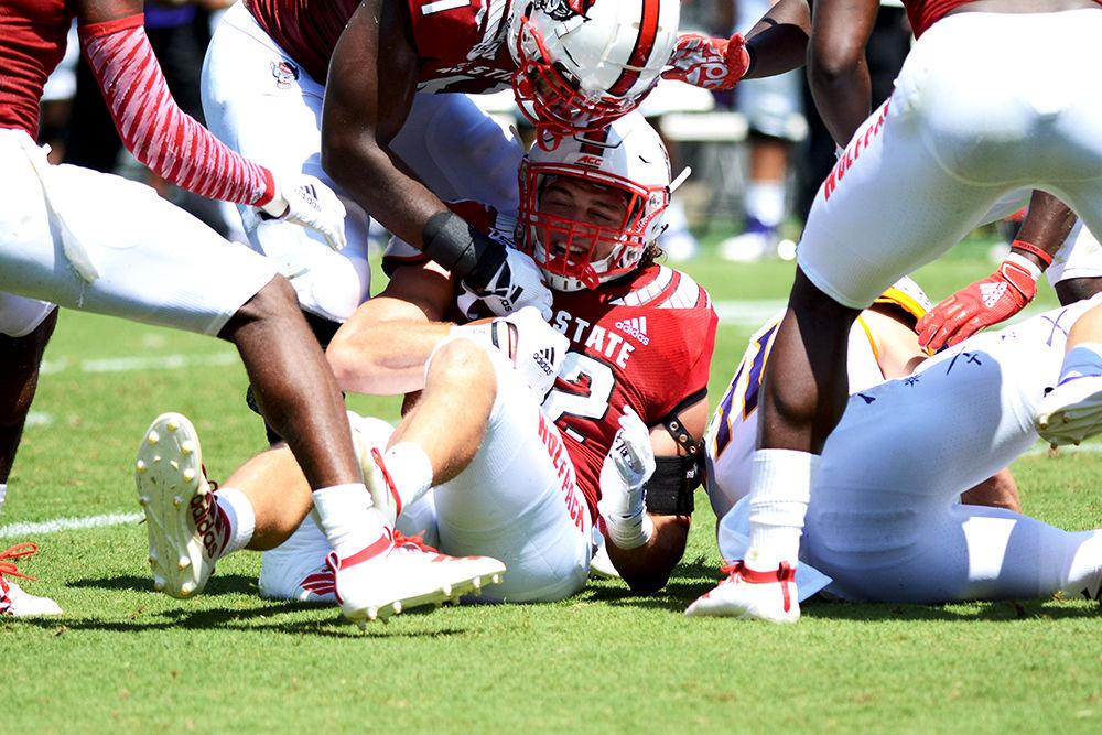 Redshirt junior linebacker Brock Miller smiles after intercepting a pass against ECU on Saturday, August 31, 2019 in Carter-Finley Stadium. The interception was called back because of a facemask penalty on James Smith-Williams. Miller had three tackles in the 34-6 win over the Pirates.