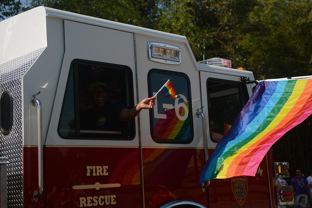 Local firefighters show their support at the Durham Pride Parade on Saturday, Sept. 28, 2019. The fire department led the march, ensuring everyone marched in safety.