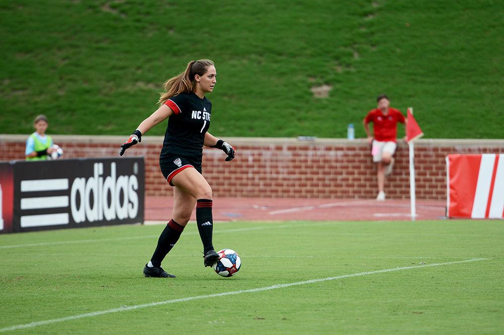 Junior goalkeeper Jessica Berlin secures the ball before putting it back into play against Furman at the Dail Soccer Field on Sunday, Sept. 15, 2019. The Wolfpack beat the Paladins 3-1.