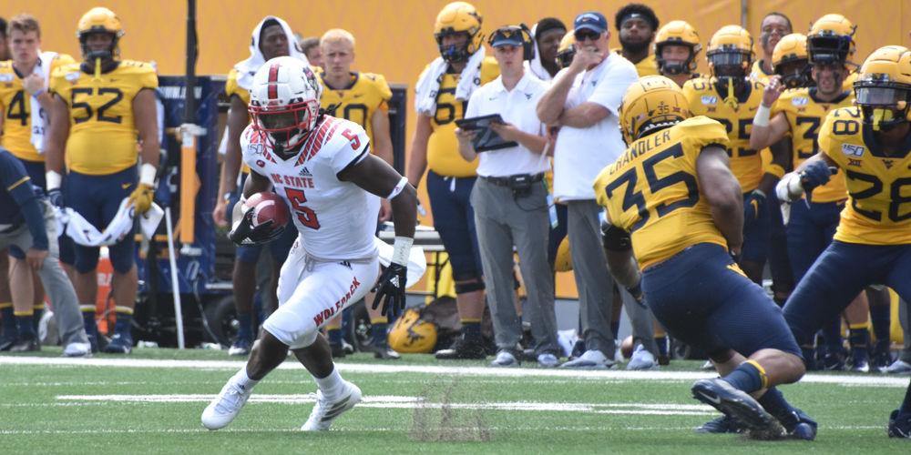 NC State graduate wide receiver Tabari Hines avoids a defender during the team's game against West Virginia on September 14, 2019 at Milan Puskar Stadium. The Wolfpack lost, 44-27.