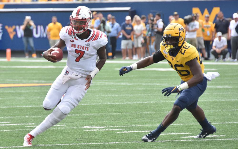 NC State redshirt sophomore quarterback Matthew McKay scrambles out of the pocket during the team's game against West Virginia on September 14, 2019 at Milan Puskar Stadium. The Wolfpack lost, 44-27.